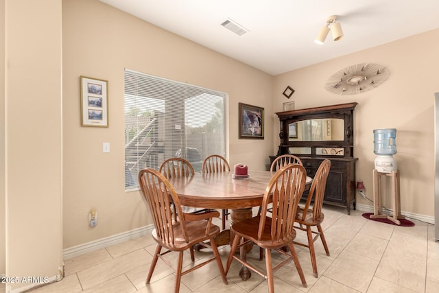 13001 W Bloomfield Rd, El Mirage, AZ 85335 - dining area featuring baseboards, visible vents, and light tile patterned flooring