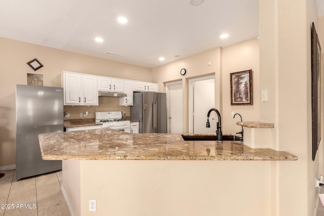 13001 W Bloomfield Rd, El Mirage, AZ 85335 - kitchen featuring high quality fridge, under cabinet range hood, a sink, gas range gas stove, and freestanding refrigerator