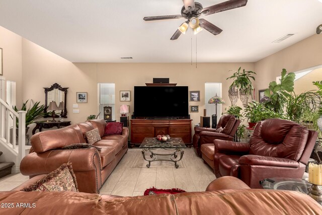 13001 W Bloomfield Rd, El Mirage, AZ 85335 - living area featuring visible vents, stairway, and a ceiling fan