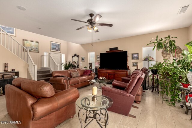 13001 W Bloomfield Rd, El Mirage, AZ 85335 - living room featuring stairs, visible vents, and a ceiling fan