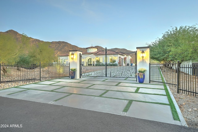 view of gate with a mountain view