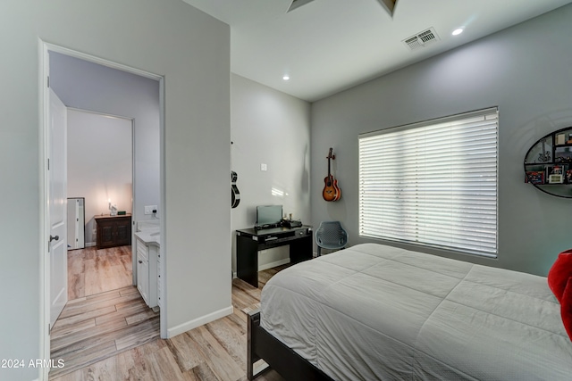 bedroom with light wood-type flooring