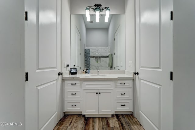 bathroom with vanity and wood-type flooring