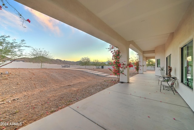 view of patio terrace at dusk