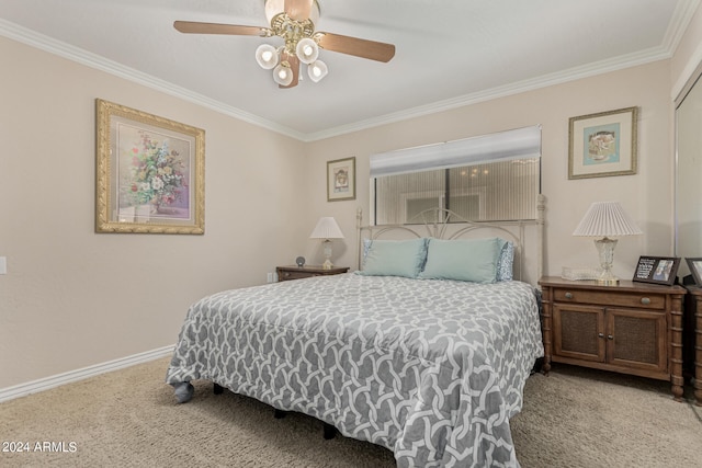 carpeted bedroom with ceiling fan and ornamental molding