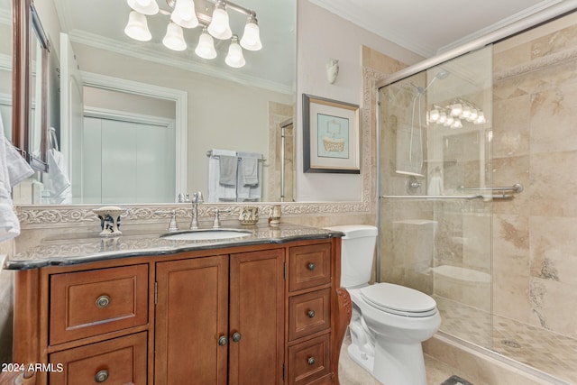 bathroom featuring a shower with shower door, vanity, and toilet