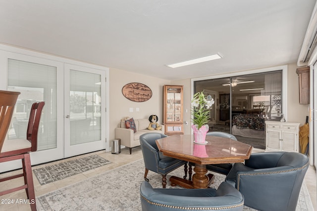 tiled dining area featuring french doors and ceiling fan