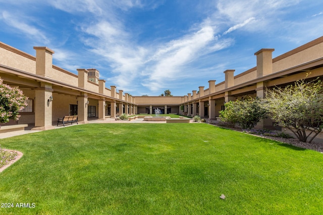 view of yard with a patio and a jacuzzi