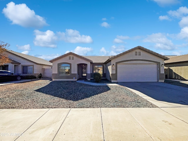 ranch-style house featuring a garage