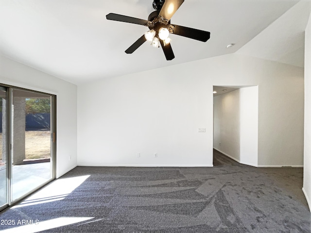 unfurnished room with vaulted ceiling, dark carpet, and ceiling fan