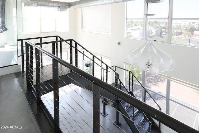 staircase with concrete floors