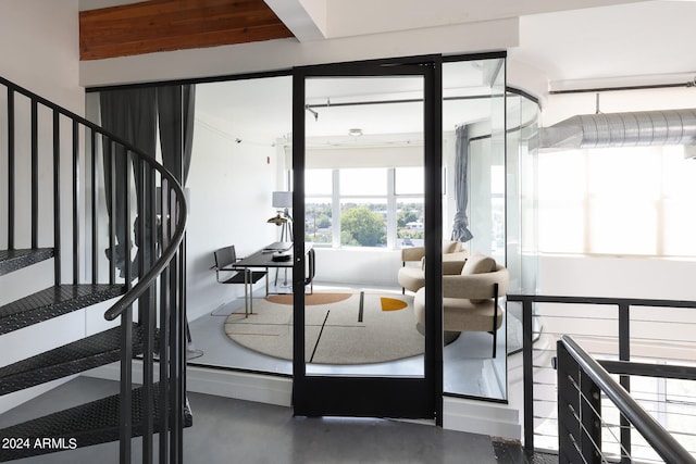 stairway with concrete flooring