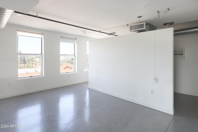 unfurnished room featuring plenty of natural light