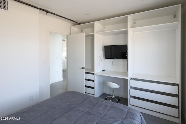 unfurnished bedroom featuring concrete floors