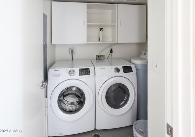 laundry area featuring cabinets and independent washer and dryer