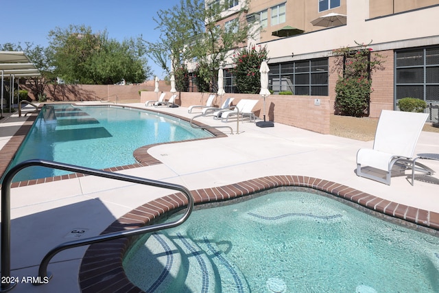 view of swimming pool featuring a patio