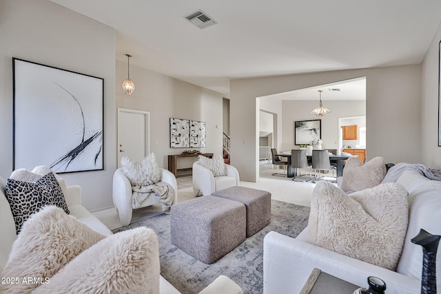 carpeted living room with visible vents