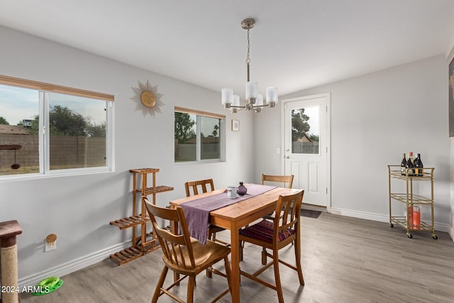 5702 S Beck Ave, Tempe, AZ 85283 - dining area featuring baseboards, a notable chandelier, and light wood finished floors