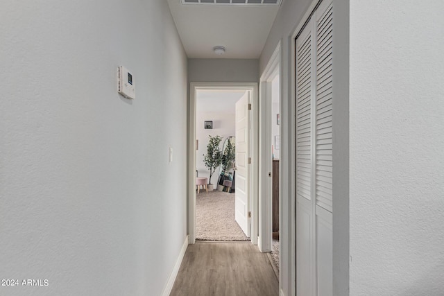 5702 S Beck Ave, Tempe, AZ 85283 - hallway with baseboards, visible vents, and wood finished floors