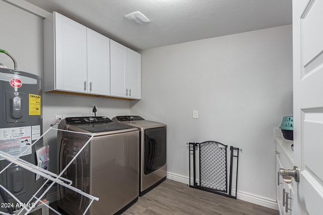 5702 S Beck Ave, Tempe, AZ 85283 - washroom with wood finished floors, baseboards, separate washer and dryer, cabinet space, and water heater