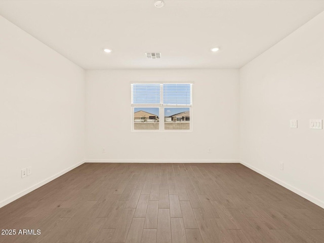 empty room with dark wood-type flooring