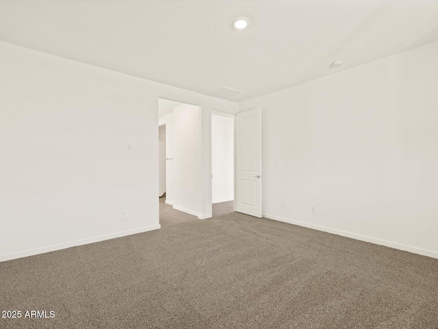 unfurnished room featuring carpet