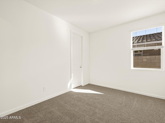 unfurnished room featuring carpet floors