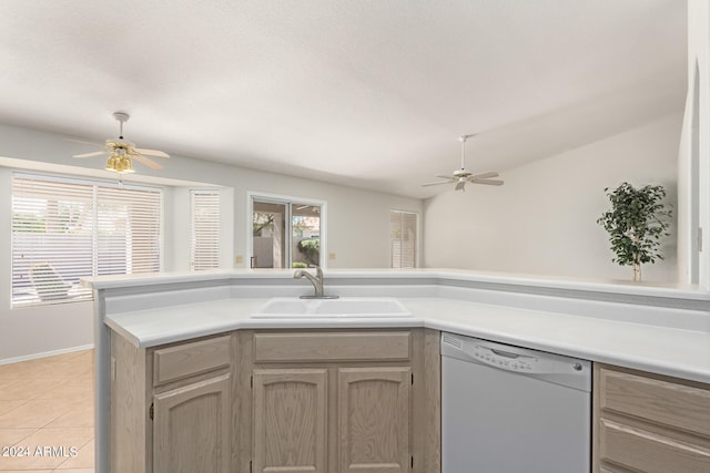 kitchen with dishwasher, sink, vaulted ceiling, light tile patterned floors, and ceiling fan