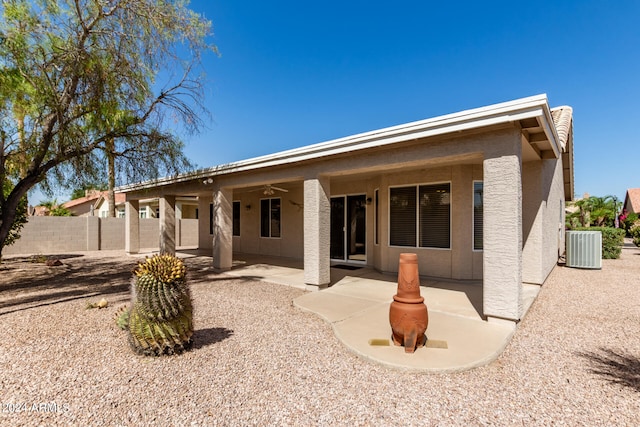 rear view of property featuring a patio, central air condition unit, and ceiling fan