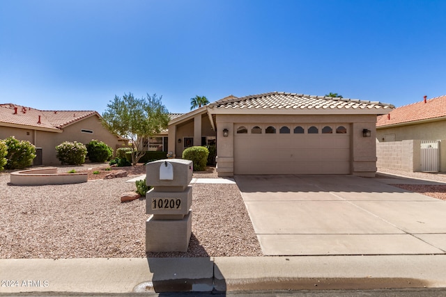 mediterranean / spanish-style home featuring a garage