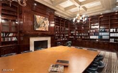 recreation room featuring beam ceiling, coffered ceiling, and a notable chandelier