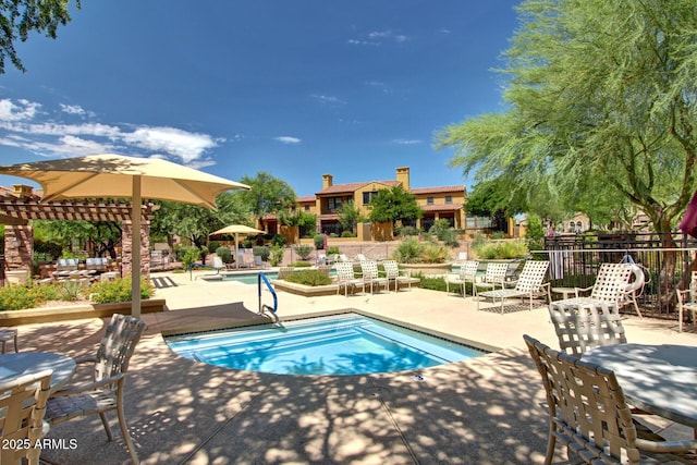 view of pool featuring a pergola and a patio area