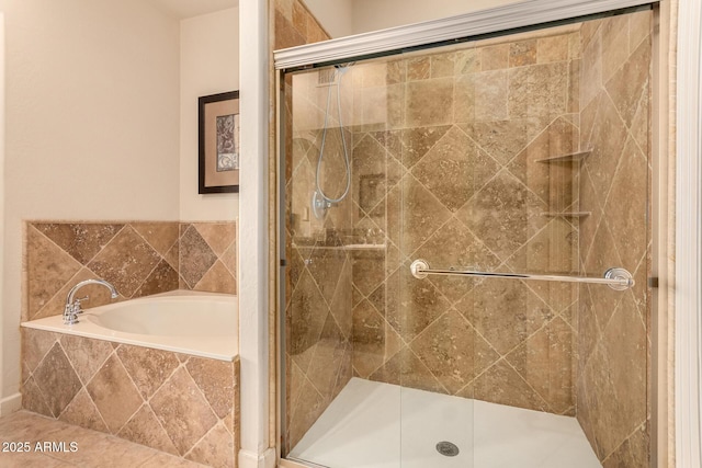 bathroom featuring separate shower and tub