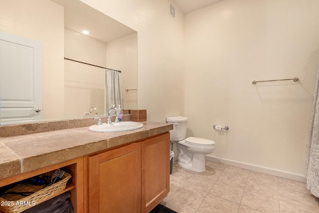 bathroom with vanity, a shower with shower curtain, tile patterned floors, and toilet