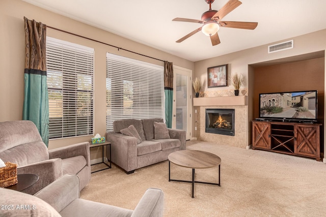 living room featuring light colored carpet and ceiling fan