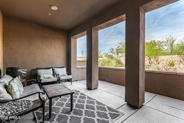 view of patio / terrace with an outdoor hangout area and a balcony