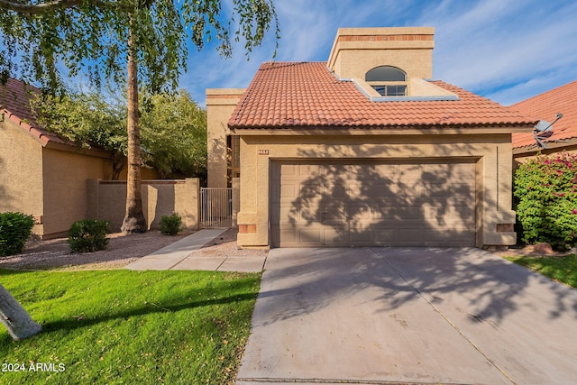 mediterranean / spanish-style house featuring a garage