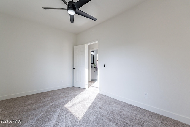 unfurnished room featuring light carpet and ceiling fan