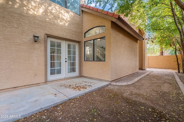 doorway to property featuring a patio and french doors