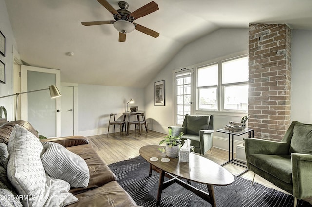 living room featuring vaulted ceiling, ceiling fan, and light hardwood / wood-style flooring