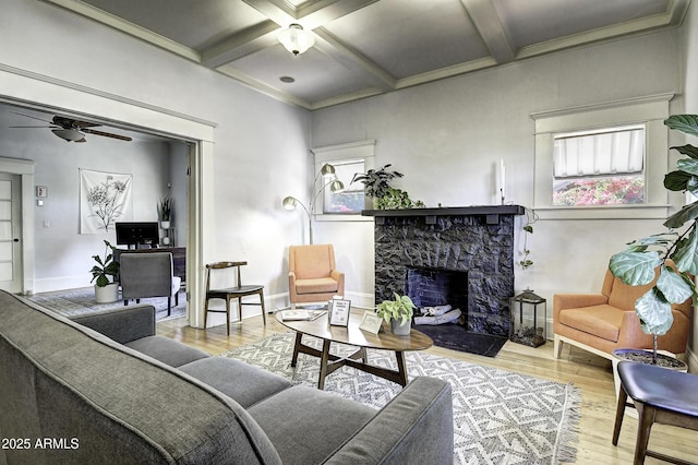 living room featuring coffered ceiling, beam ceiling, a wealth of natural light, and hardwood / wood-style flooring