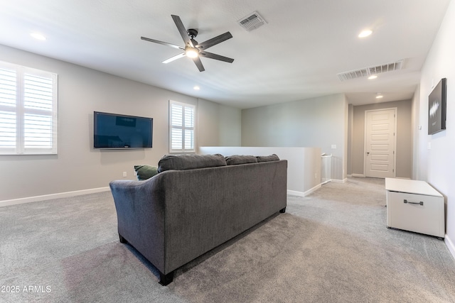 living room featuring ceiling fan and carpet flooring