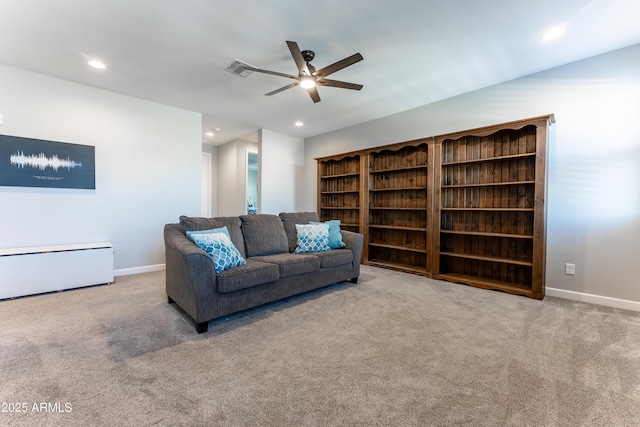 carpeted living room featuring ceiling fan