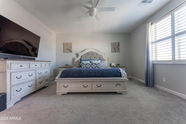 bedroom with ceiling fan and light carpet