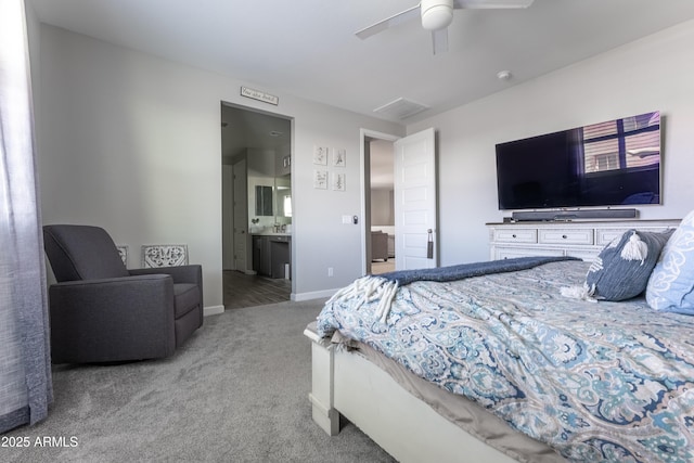 carpeted bedroom featuring ceiling fan and ensuite bath