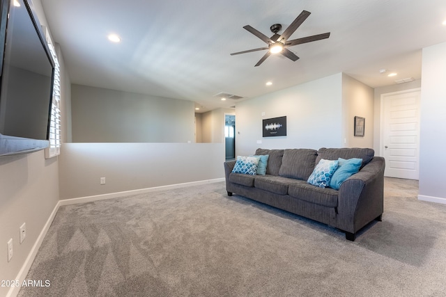 living room with ceiling fan, carpet flooring, and a wealth of natural light