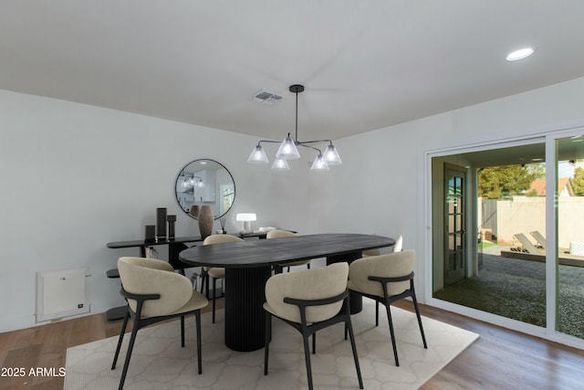 dining space featuring recessed lighting, visible vents, and light wood finished floors