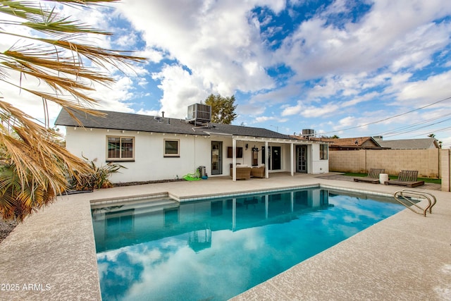 view of pool featuring a fenced in pool, cooling unit, a patio area, and fence