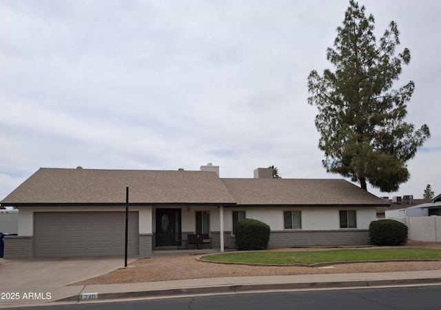 740 N Oracle, Mesa, AZ 85203 - ranch-style home featuring concrete driveway, an attached garage, stucco siding, and brick siding