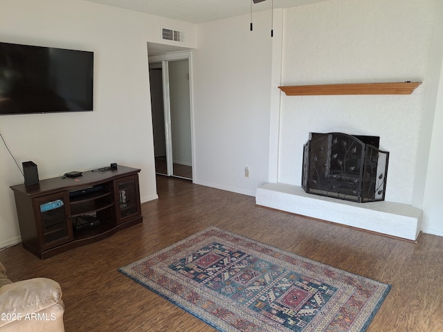 740 N Oracle, Mesa, AZ 85203 - living room featuring wood finished floors and a fireplace with raised hearth